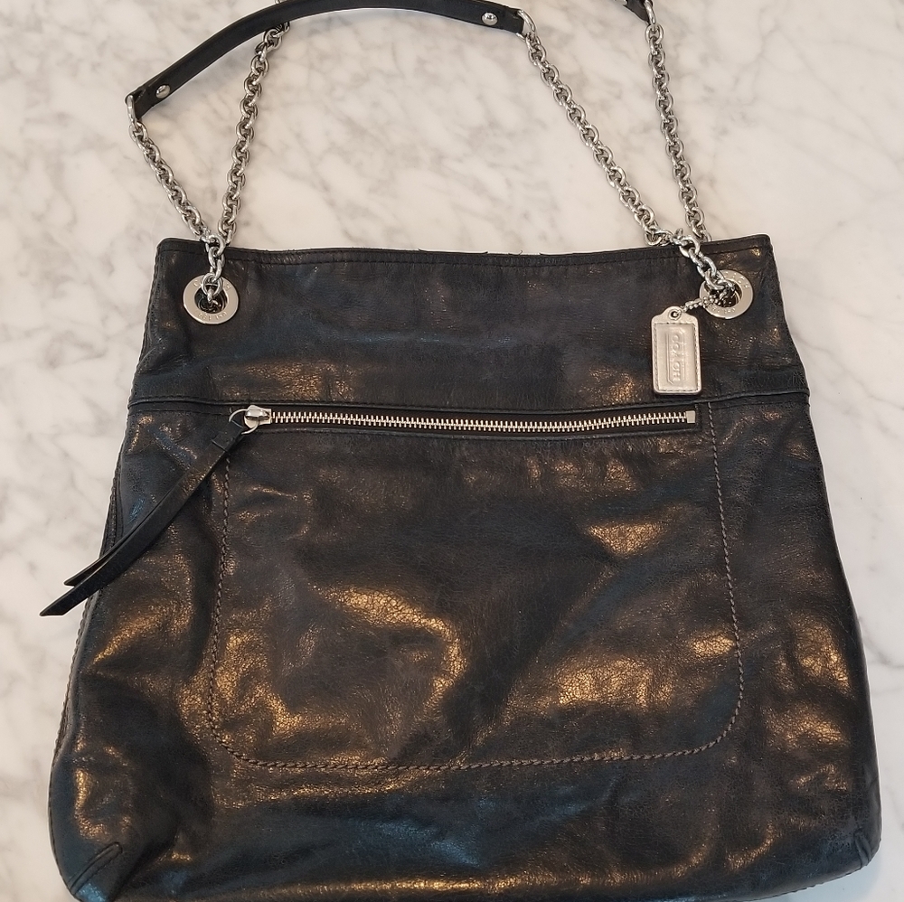 Coach tore or crossbody leather bag.